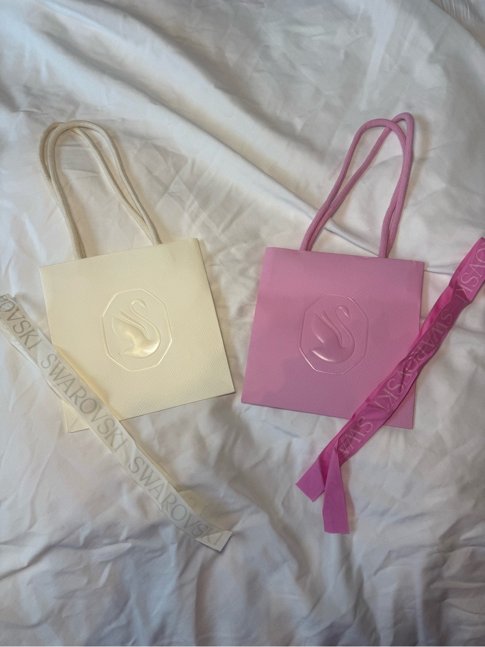 Swarovski pink and white shopping bag with ribbon